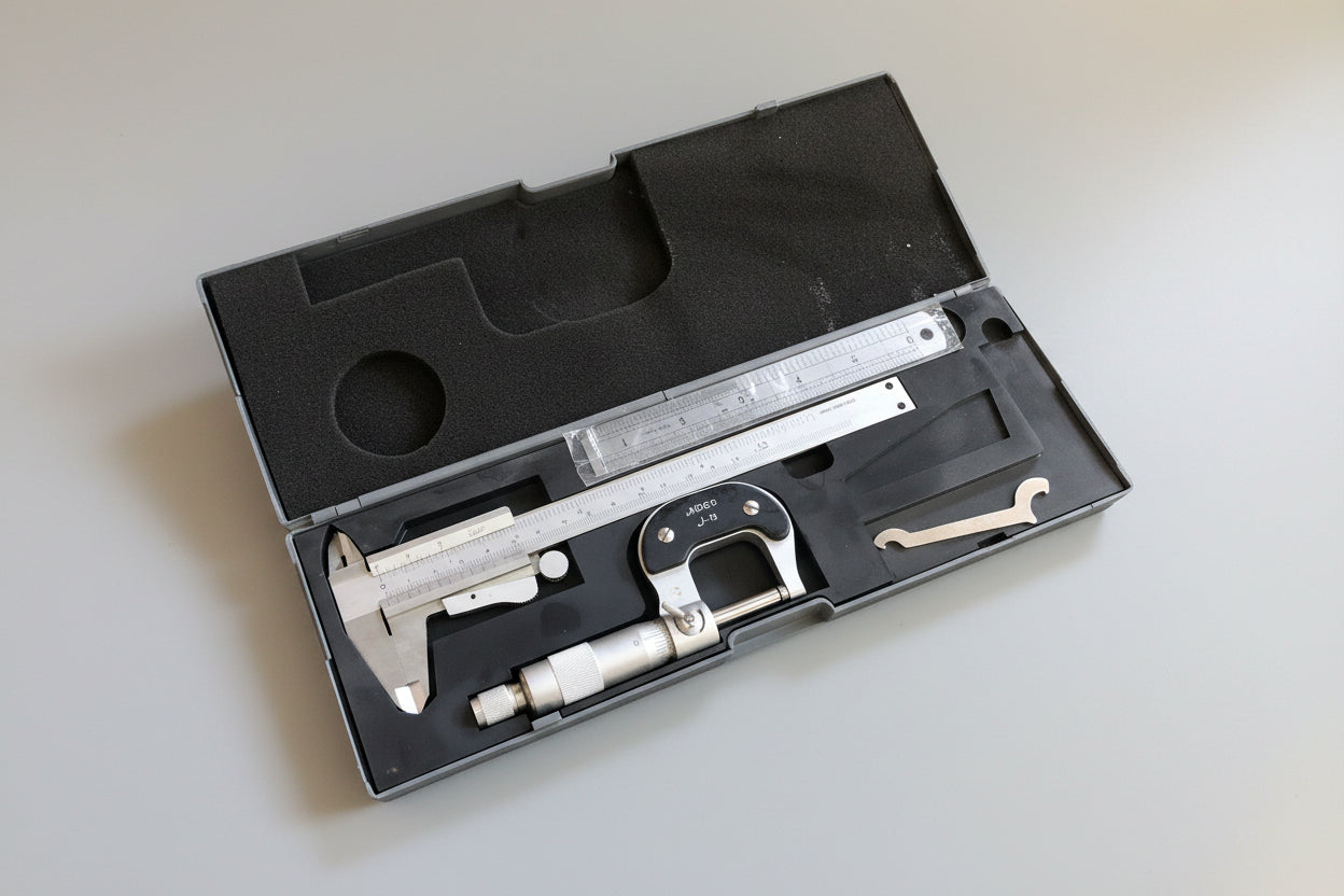Caliper in a black case on a textured carpet